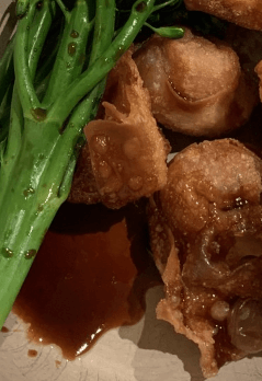 martha's peruvian chilli dumpling sauce in a bowl on wontons